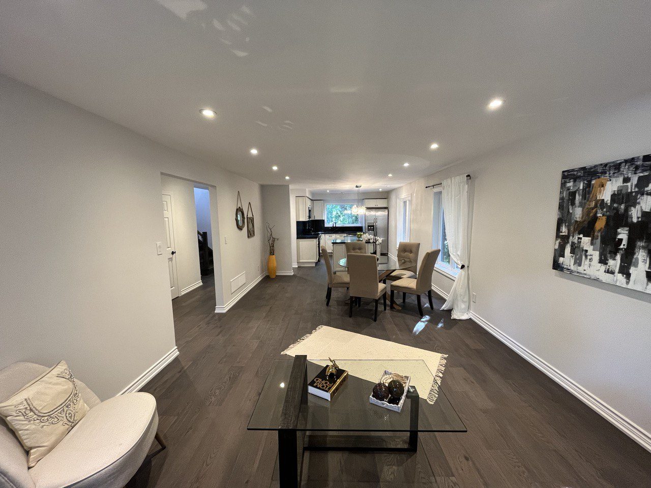 Great room after renovation, furnished with new flooring